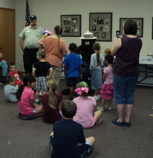 Smokey the Bear visits with kids on Certificate Day.